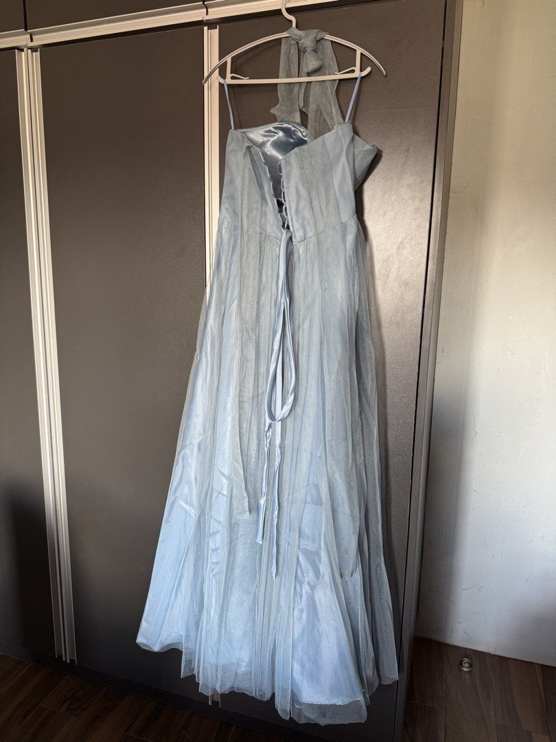 Light Blue Dress Gown (Category: Evening dresses & gowns) located in Dasmarinas. Submitted by akelvin23 (Listing ID 1470112361, Image 2). Description: - Color: Light blue - Material: Tulle overlay with smooth satin lining - Closure: Adjustable lace-up corset back with ribbon ties - Length: Flowing floor-length skirt - Condition: Worn only once, freshly cleaned, and ready to wear Dusty blue Waist - 32 in Bust - 34 in approx Length - 50 in - from p