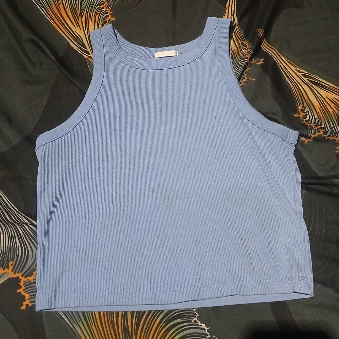 Light blue ribbed crop tank top (Category: Sleeveless) located in Manila. Submitted by iiselou (Listing ID 1470102789, Image 1). Description: - Color: Light blue - Style: Ribbed crop top, high crew neckline, sleeveless - Material: Stretchy cotton blend - Fit/Use: Great for layering or wearing on warm days - Condition: Excellent, clean with no stains or damage.