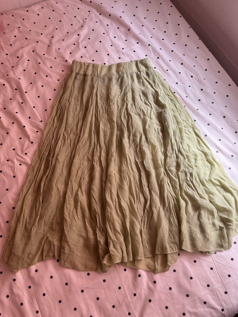 Light green long crinkled skirt boho style (Category: Skirts) located in Manila. Submitted by chimcheese (Listing ID 1469760987, Image 2). Description: - Color: Light green - Style: Long crinkled skirt with elastic waistband - Length: Hits around the lower calf - Material: Lightweight and breathable, perfect for warm weather - Versatility: Flows nicely when walking, pairs great with belts and casual tops.