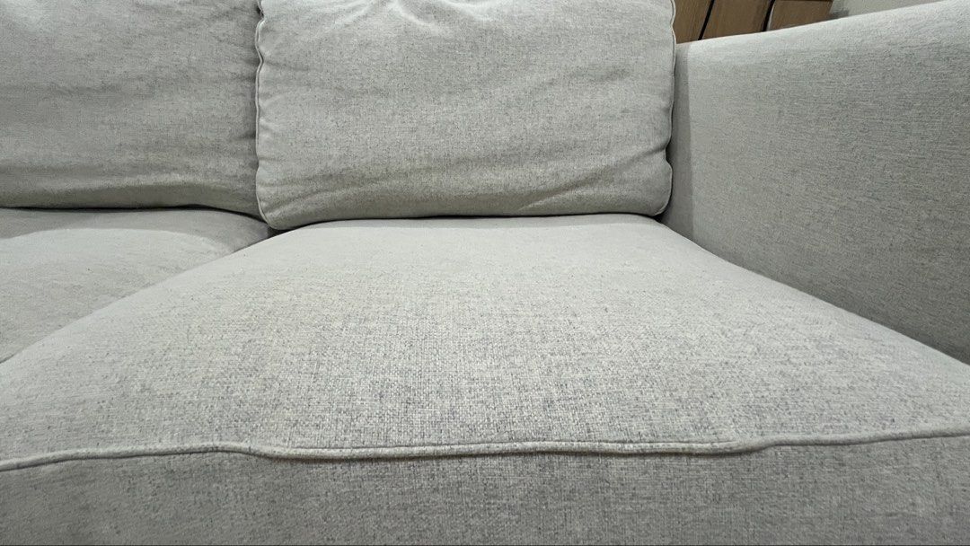 Light Grey Wide 2-Seater Ikea Fabric Sofa (Category: Sofas) located in Pasig City. Submitted by clean_whistle (Listing ID 1470084996, Image 2). Description: Selling our IKEA sofa for ₱13,000. Originally purchased for ₱21,000, this sofa has been used for only 2 years and is still in like-new condition. Sofa Details: * Selling Price: ₱13,000 * Original Price: ₱21,000 * Age: 2 years * Condition: Like new and well-maintained * Comfort: Soft and comfo