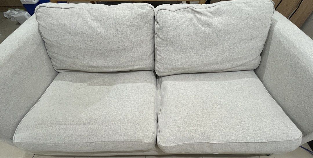 Light Grey Wide 2-Seater Ikea Fabric Sofa (Category: Sofas) located in Pasig City. Submitted by clean_whistle (Listing ID 1470084996, Image 3). Description: Selling our IKEA sofa for ₱13,000. Originally purchased for ₱21,000, this sofa has been used for only 2 years and is still in like-new condition. Sofa Details: * Selling Price: ₱13,000 * Original Price: ₱21,000 * Age: 2 years * Condition: Like new and well-maintained * Comfort: Soft and comfo