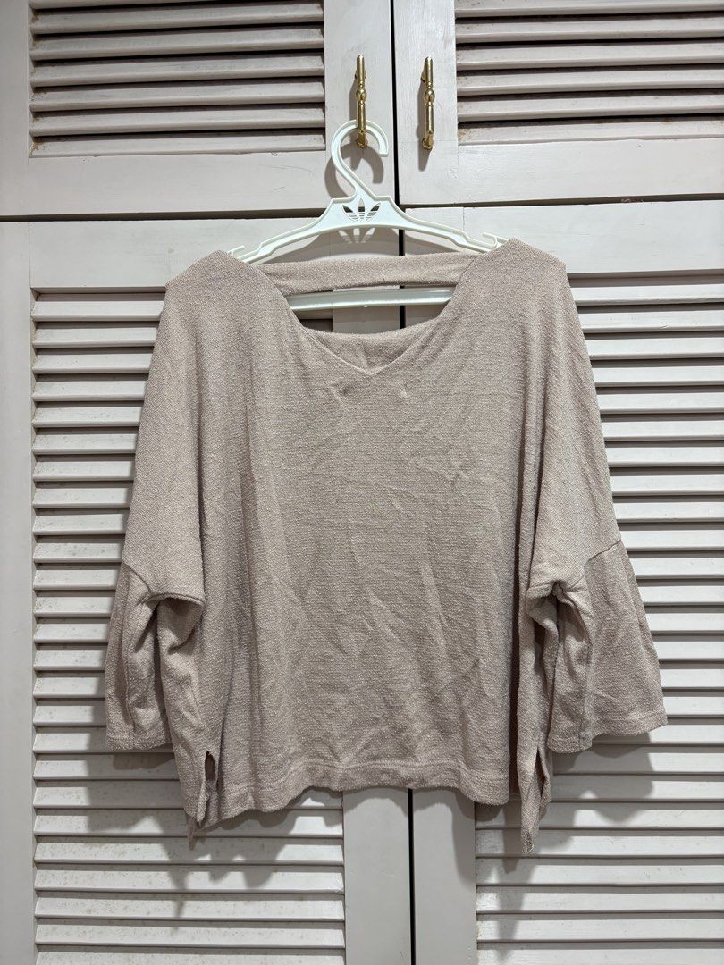 Light pink knit top (Category: Longsleeves) located in Muntinlupa City. Submitted by sukimum (Listing ID 1469979957, Image 2). Description: Loose fit top with bell sleeves and side slits. Fits S-M frames. Super cute and easy to pair!.