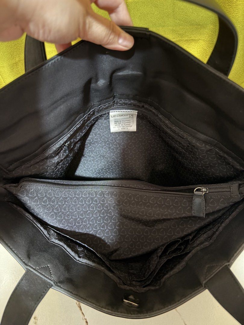 Liz Claiborne Black Tote Bag (Category: Shoulder Bags) located in Borongan. Submitted by charmspreloveddd (Listing ID 1469989710, Image 2). Description: - Brand: Liz Claiborne - Color: Classic Black - Origin: Made in the Philippines - Design: Structured handles with a clean exterior - Interior: Spacious compartment with dark fabric lining - Organization: Includes 1 internal zip pocket and smaller compartments - Versatility: Great size for daily u