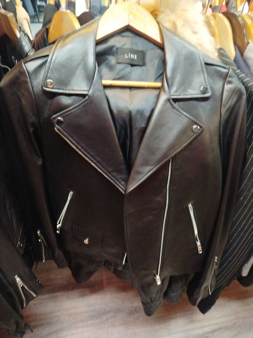 LÎNE Black Biker Leather Jacket (Category: Coats, Jackets and Outerwear) located in Quezon City. Submitted by cuteitemsonlyyy (Listing ID 1470101258, Image 2). Description: - Brand: LÎNE - Color: Classic Black - Material: Smooth faux leather with soft inner lining - Design: Asymmetric front zipper, lapel snap buttons, and zipped side pockets - Fit/Dimensions: Sleeve length approx. 22 inches, total length approx. 21 inches - Style: Timeless moto j