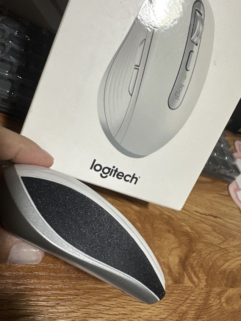 Logitech MX Anywhere 3 for Mac (Category: Mouse & Mousepads) located in Muntinlupa City. Submitted by clairebobot (Listing ID 1470139011, Image 2). Description: - Model: Logitech Wireless Mouse - Color: White and Silver with textured black side grips - Design: Ergonomic shape for comfortable daily use - Features: 2 extra thumb buttons for quick navigation - Condition: Great working condition for office or desktop setups - Inclusions: Original box