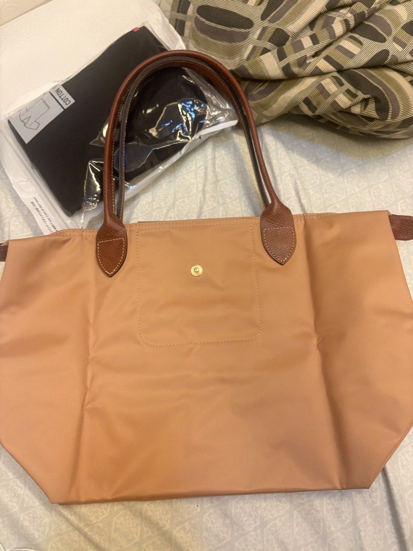 Longchamp medium long handle in Fawn color (Category: Tote Bags) located in Malolos. Submitted by 3Coolitz (Listing ID 1451339928, Image 3). Description: Last price! Used twice only because I am using the black color. Gold na gold pa yung hardwares With small dirt on corners. Bought in Rustan’s so you will have a peace of mind that it’s authentic. Price in Rustan’s currently is Php10,500.