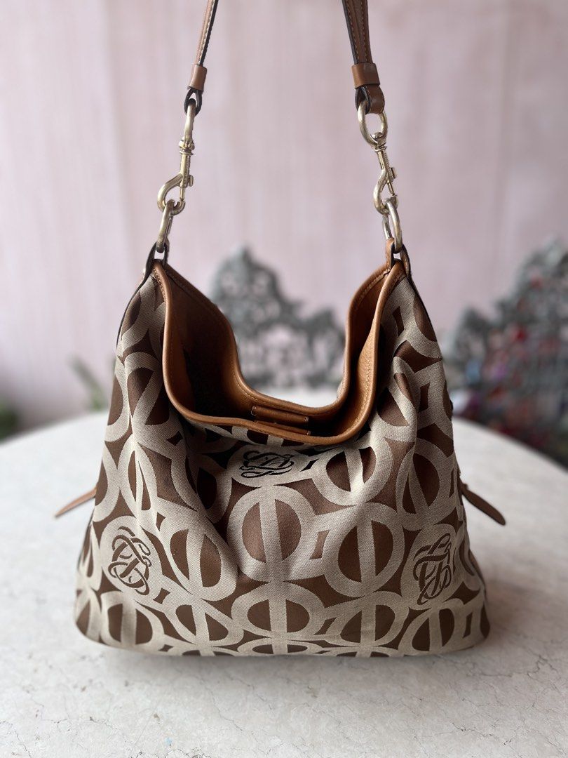 Louis Quatorze Canvas-Leather Hobo Bag (Category: Shoulder Bags) located in Las Pinas. Submitted by pastel_rewind_ph (Listing ID 1469965504, Image 3). Description: Louis Quatorze Canvas-Leather Hobo Bag Orig bought for 1,000php - Canvas Fabric Body and Inner Nylon Lining - Magnet Closure - Genuine Leather Trim, Bottom, Edges and Strap - Flaws: Rubs on the leather trim edges (normal sign of wear), Color transfer on the side leather, dark rubs on t
