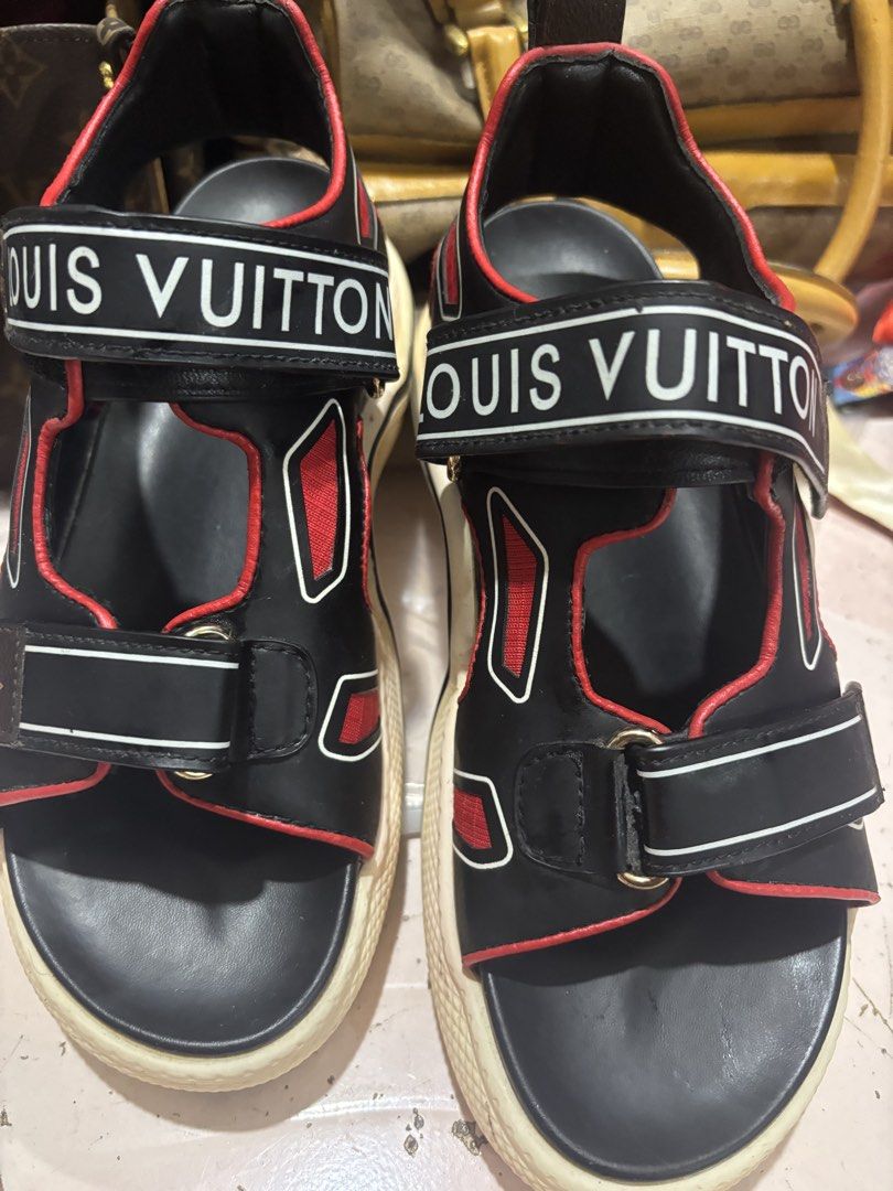 Louis Vuitton Black Red Platform Sandals (Category: Flats & Sandals) located in Rizal. Submitted by riri.rarapreloved (Listing ID 1469961360, Image 1). Description: - Brand: Louis Vuitton Platform Sandals - Colorway: Striking Black and Red with crisp White chunky soles - Design: Wide Velcro straps with bold white branding and signature Monogram canvas tab - Details: Red trim cutouts and iconic red circular LV logo on the back heel - Sole: Texture