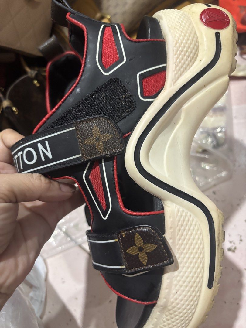 Louis Vuitton Black Red Platform Sandals (Category: Flats & Sandals) located in Rizal. Submitted by riri.rarapreloved (Listing ID 1469961360, Image 2). Description: - Brand: Louis Vuitton Platform Sandals - Colorway: Striking Black and Red with crisp White chunky soles - Design: Wide Velcro straps with bold white branding and signature Monogram canvas tab - Details: Red trim cutouts and iconic red circular LV logo on the back heel - Sole: Texture