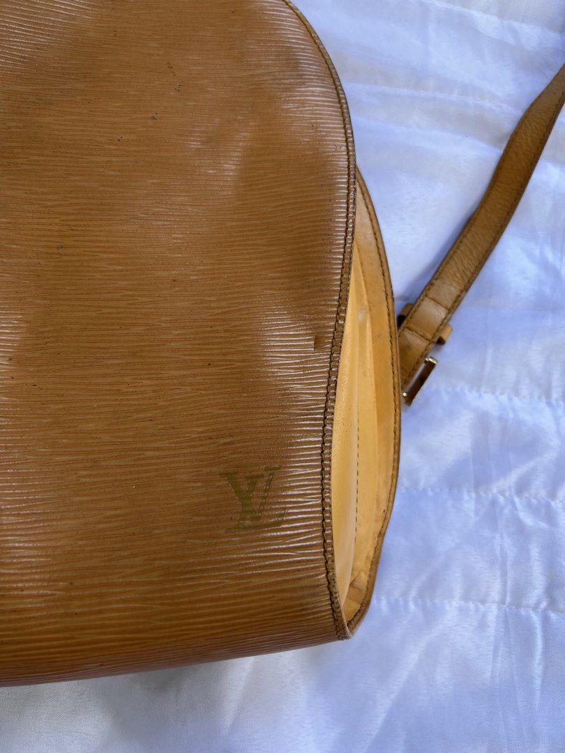 Louis Vuitton Epi Leather Yellow Mantes Backpack (Category: Luxury Bags & Wallets) located in Manila. Submitted by mightylion-ce6ea7 (Listing ID 1469954024, Image 2). Description: - vintage Louis Vuitton backpack - Crafted from durable yellow Epi leather with gold-toned hardware - Features adjustable shoulder straps, secure top zip closure, and an external vertical zip pocket - Classic textured finish with subtle embossed LV logo on the bottom co