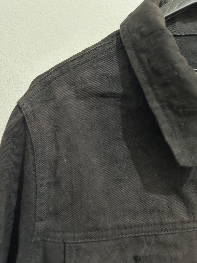 Louis Vuitton Monogram Black Denim Jacket (Category: Coats, Jackets and Outerwear) located in Angeles City. Submitted by cassey_phoenix (Listing ID 1469970667, Image 3). Description: - Style: Classic streetwear black denim jacket - Design: Allover tonal monogram pattern with branded hardware - Pockets: Convenient chest flap pockets and side welt pockets - Details: Structured collar, buttoned cuffs, and unique blue interior neck label with orange 