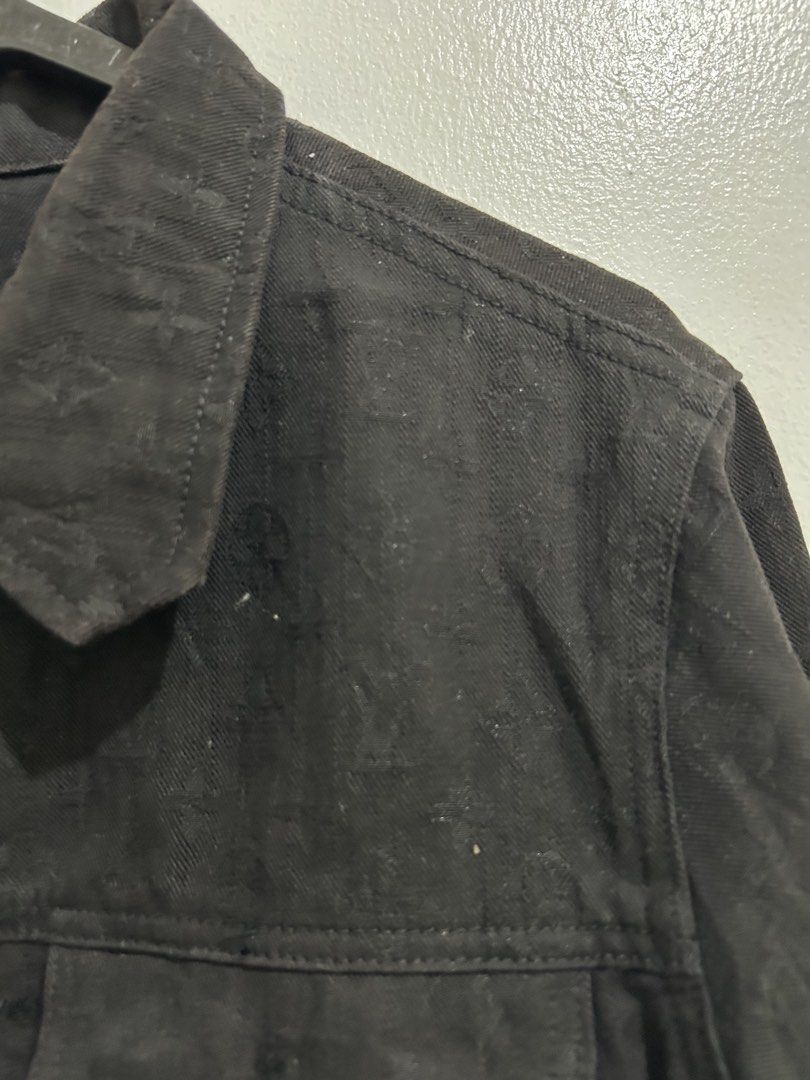 Louis Vuitton Monogram Black Denim Jacket (Category: Coats, Jackets and Outerwear) located in Angeles City. Submitted by cassey_phoenix (Listing ID 1469970667, Image 2). Description: - Style: Classic streetwear black denim jacket - Design: Allover tonal monogram pattern with branded hardware - Pockets: Convenient chest flap pockets and side welt pockets - Details: Structured collar, buttoned cuffs, and unique blue interior neck label with orange 