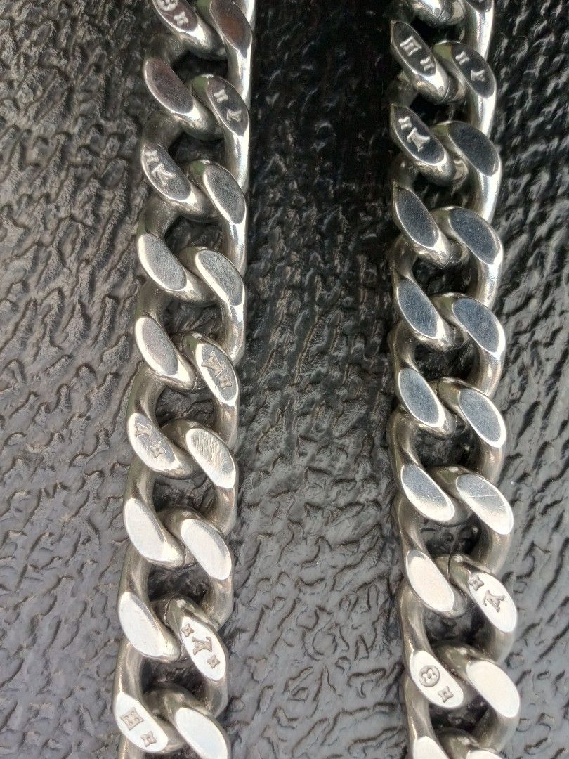Authentic Louis Vuitton Monogram Chain Necklace M68273 (Category: Luxury Accessories) located in Malolos. Submitted by lizarondoe59660 (Listing ID 1470099846, Image 2). Description: - Brand: Louis Vuitton - Model: M68273 - Finish: Polished silver with solid weight - Design: Chunky link style with engraved Monogram pattern - Closure: Secure clasp featuring LV logo square detail - Styling: Perfect to wear solo or layered - Condition: 100% authentic