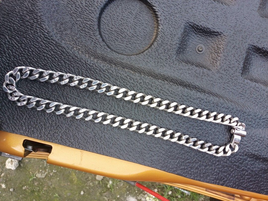 Authentic Louis Vuitton Monogram Chain Necklace M68273 (Category: Luxury Accessories) located in Malolos. Submitted by lizarondoe59660 (Listing ID 1470099846, Image 3). Description: - Brand: Louis Vuitton - Model: M68273 - Finish: Polished silver with solid weight - Design: Chunky link style with engraved Monogram pattern - Closure: Secure clasp featuring LV logo square detail - Styling: Perfect to wear solo or layered - Condition: 100% authentic