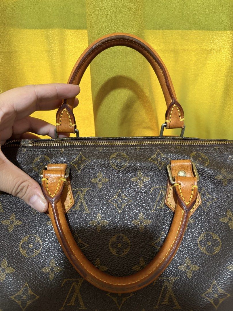 Louis Vuitton Monogram Speedy Handbag (Category: Purses & Pouches) located in Borongan. Submitted by charmspreloveddd (Listing ID 1469980928, Image 2). Description: - Authentic and coded Vintage Monogram coated canvas with vachetta leather handles and trim - Classic gold-tone hardware and secure zip closure - Brown fabric interior lining featuring a convenient small side pocket - Made in France - Date code: SP0068 - Timeless and versatile everyda