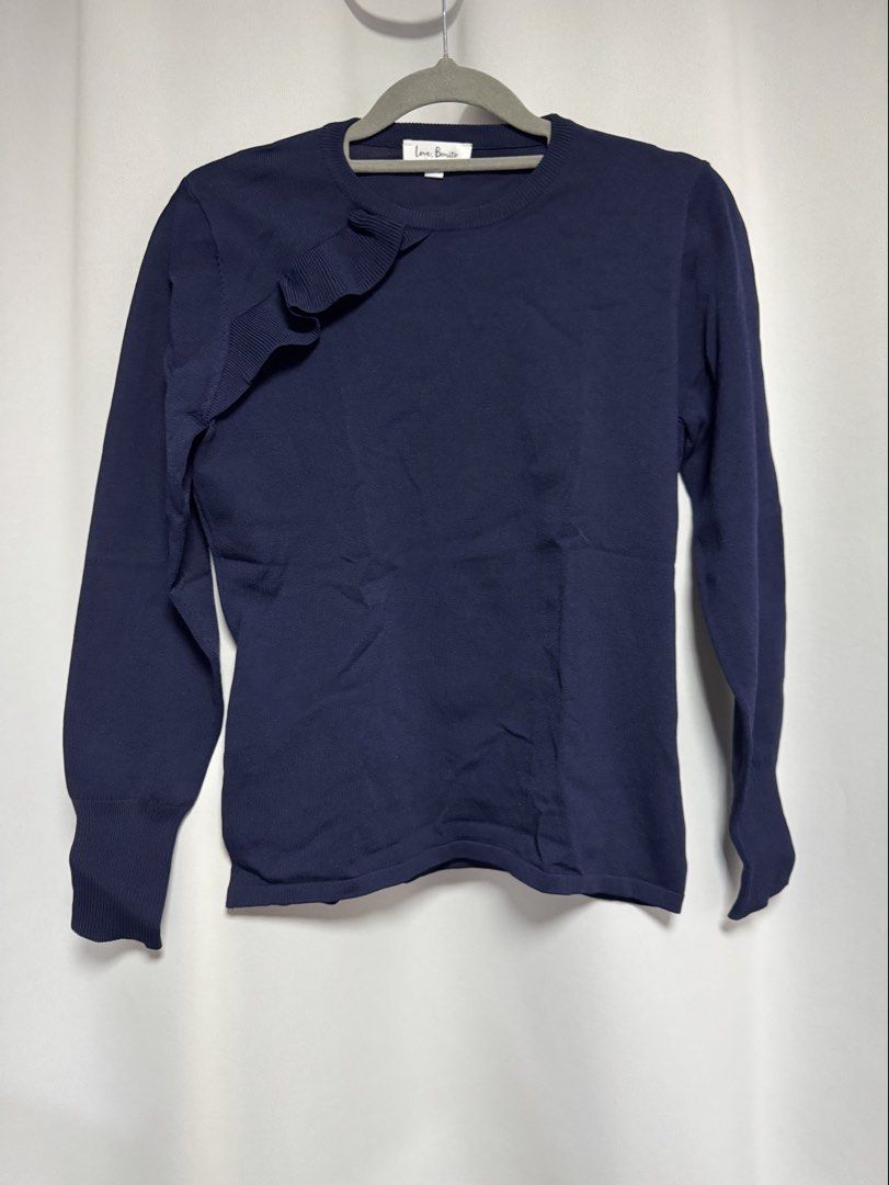Love Bonito Navy Blue Ruffle Knit Top (Category: Sleeveless) located in Calamba. Submitted by cheriiv (Listing ID 1469953097, Image 2). Description: Washed, never worn - Brand: Love Bonito - Color: Classic navy blue - Size: M (UK 10, US 6) - Design: Round neckline with a chic ribbed ruffle detail on the right shoulder and chest - Fit: Fitted silhouette with ribbed cuffs and hem - Material: Clean, soft fabric with great stretch - Styling: Versatil