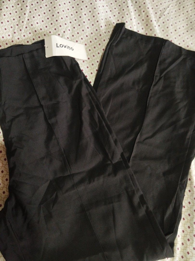 Lovito Black Trousers Size M (Category: Other Bottoms) located in Manila. Submitted by lene48 (Listing ID 1470023943, Image 2). Description: - Brand: Lovito - Color: Black - Size: M, 28 to 29 waist, 40 length - Condition: Brand new with original tag attached - Style: Straight leg with stitched front crease lines and clean waistline - Occasion: Perfect for office wear or casual outings.
