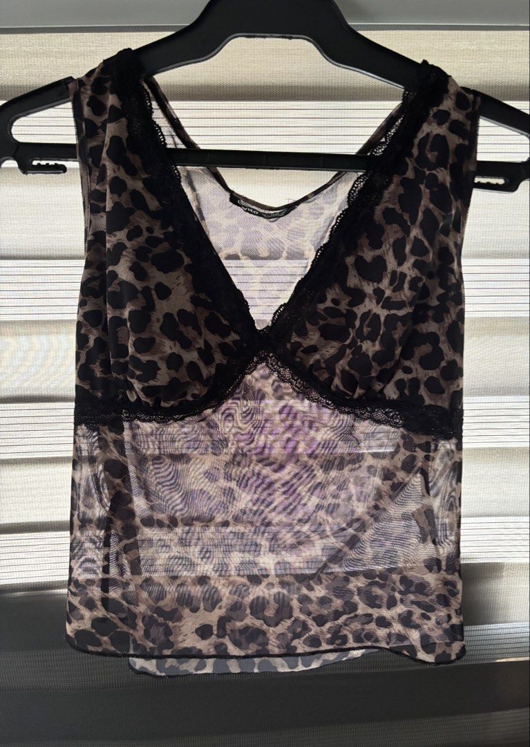 lovito leopard print top (Category: Sleeveless) located in Manila. Submitted by iyahpreloved_ (Listing ID 1469970750, Image 1). Description: size L!.