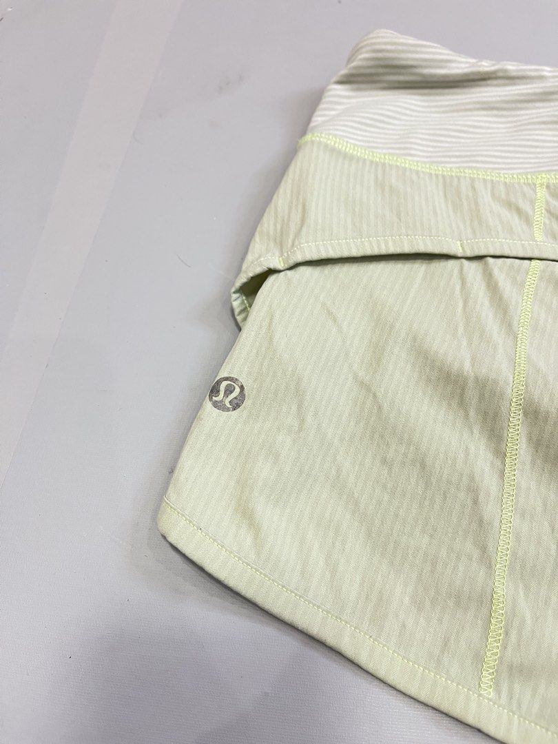 Lululemon Athletic Shorts Light Green Size 6 (Category: Shorts) located in Mabalacat. Submitted by aas_thriftfings (Listing ID 1470102945, Image 3). Description: - Brand: Lululemon - Color: Light green with lime green accent stitching - Size: 6 (verified by size dot inside pocket) - Features: Striped waistband, secure back zipper pocket with pull tab, and built-in liner - Fabric: Lightweight, breathable, and comfortable for running or active wear