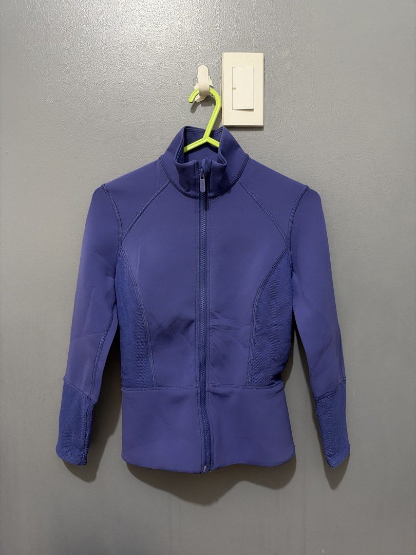 Lululemon Athletic Zip Jacket Purple Size 2 (Category: Coats, Jackets and Outerwear) located in Cainta. Submitted by shesellsss (Listing ID 1470002638, Image 1). Description: - Brand: Lululemon - Style: Athletic jacket with full front zipper and structured collar - Color: Purple - Size: 2 (tag intact) - Material: 57% nylon, 24% polyester, 19% lycra elastane - Design: Textured panels on sides and sleeves - Origin: Made in Vietnam.
