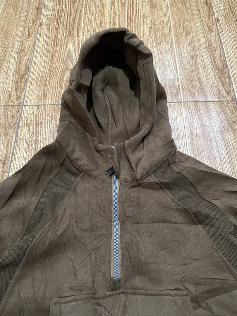 Lululemon Brown Half-Zip Hoodie Size 6 (Category: Coats, Jackets and Outerwear) located in Manila. Submitted by christian.thrift_4 (Listing ID 1469953603, Image 3). Description: Lululemon brown half-zip hoodie in size 6. Ribbed panels under the arms and side body. Front kangaroo pocket with hood and drawstring. Soft fleece interior lining. Made with cotton, polyester, nylon, and elastane blend. Tag inside the collar. Great dark brown neutral shad