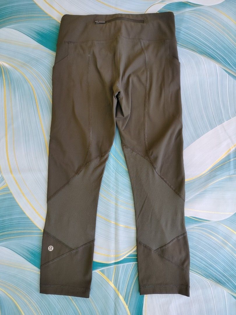 Lululemon Olive Green Crop Leggings Size 4 (Category: Activewear) located in Manila. Submitted by geraldquinto_917 (Listing ID 1470080067, Image 1). Description: - Brand: Lululemon - Size: 4 -Length 30 - Color: Olive Green - Length: Mid-calf / Crop - Features: Geometric leg panels, secure back zippered pocket, side drop-in pockets - Details: Iconic omega logo near hem and inside waistband size dot - Condition: Clean, stretchy fabric, great for ru