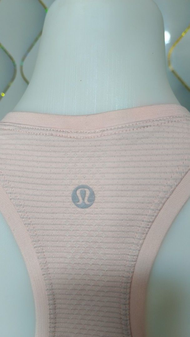 Lululemon Racerback Tank Top Still Your Mind (Category: Sleeveless) located in Manila. Submitted by zariyah.1986 (Listing ID 1469955044, Image 3). Description: - Brand: Lululemon - Style: Seamless racerback tank top with subtle stripes - Features: Breathable fabric, iconic silver reflective logo on back collar - Special Detail: Motivational text prints inside the hem ('STILL YOUR MIND' & 'MOVE YOUR BODY') - Condition: Great for workouts, yoga, an