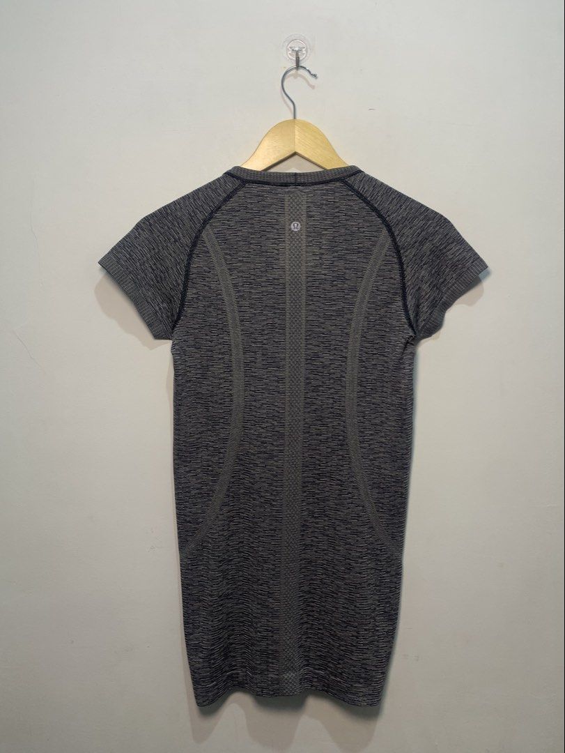 Lululemon Swiftly Tech Short Sleeve Crew (Category: Shirts) located in Davao. Submitted by legitseller1111 (Listing ID 1470126886, Image 2). Description: - Brand: Lululemon - Model: Swiftly Tech Short Sleeve Crew - Size: Medium - Color: Dark grey/blue marled - Material: Lightweight, breathable, seamless athletic fabric - Features: Motivational 'SWEAT LIFE / RUN WITH HEART' inner hem print, short sleeves, crew neck - Condition: Excellent pre-loved
