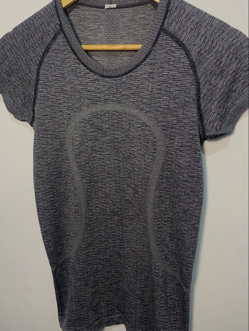 Lululemon Swiftly Tech Short Sleeve Crew (Category: Shirts) located in Davao. Submitted by legitseller1111 (Listing ID 1470126886, Image 3). Description: - Brand: Lululemon - Model: Swiftly Tech Short Sleeve Crew - Size: Medium - Color: Dark grey/blue marled - Material: Lightweight, breathable, seamless athletic fabric - Features: Motivational 'SWEAT LIFE / RUN WITH HEART' inner hem print, short sleeves, crew neck - Condition: Excellent pre-loved