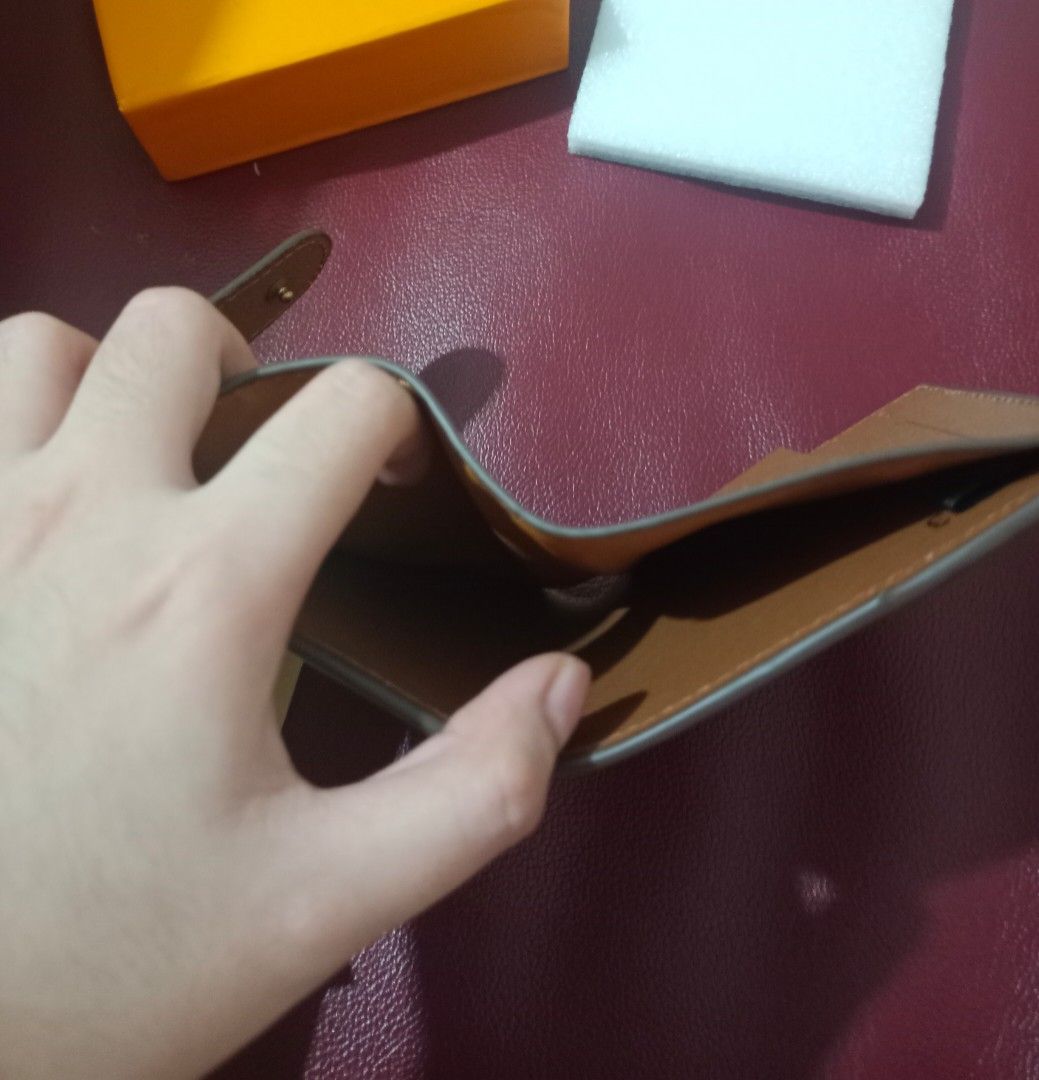 LV Monogram Wallet (Category: Luxury Bags & Wallets) located in Manila. Submitted by lilith871 (Listing ID 1467201858, Image 2). Description: Classic Monogram Wallet - Not really used. - Clean Card Slots and also can put Cash - Price is negotiable for serious buyers Inclusions: Dust bag and Box (there are some damages in the Box) 💳 Payment: GCash / Maya 🚚 Delivery: J&T Express (Buyer will shoulder the delivery fee) , 🤝 Meetup: Around Cabanatua