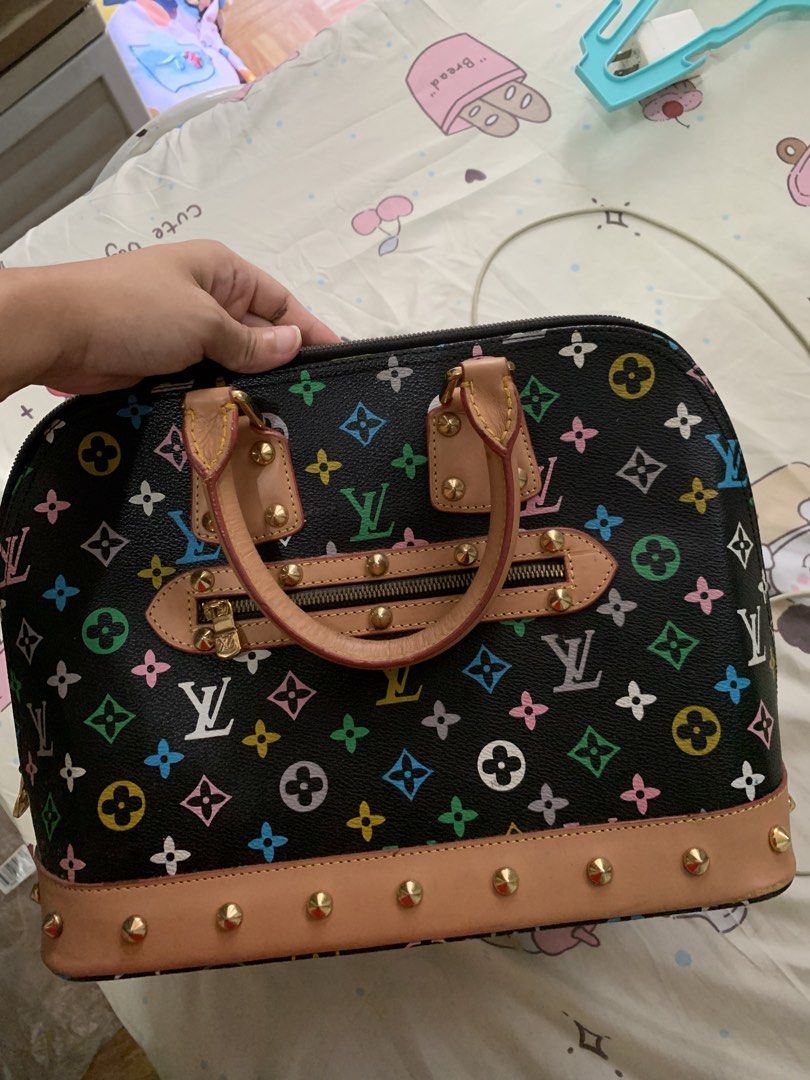 LV Multicolore Alma Handbag (Category: Luxury Bags & Wallets) located in Manila. Submitted by usagichan_rabbit (Listing ID 1469966693, Image 2). Description: - Not O*G/not authen*tic Louis Vuitton handbag in black Monogram Multicolore canvas - Vachetta leather trim accented with stylish brass studs along the base - Dual rolled leather handles for comfortable carrying - Secure top zip closure and convenient front zip pocket - Light-colored interio