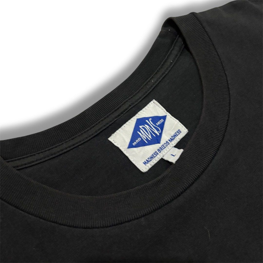 Madness MDNS Graphic Tee (Category: Tshirts & Polo Shirts ) located in Quezon City. Submitted by grailph (Listing ID 1470064311, Image 3). Description: - Brand: Madness - Color: Black - Size: Large - Dimension: 21”x26” - Design: 'Mad the third' graphic print on chest - Details: Woven brand patch on interior collar and back exterior - Material: Comfortable cotton with crew neck and short sleeves - Condition: Clean, solid streetwear vibe Color rate