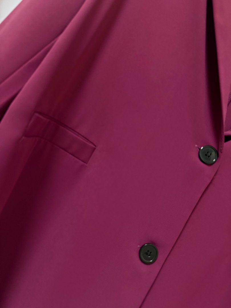 Magenta pink oversized buttoned blazer jacket (Category: Coats, Jackets and Outerwear) located in Quezon City. Submitted by lovedbymaxandmikoy (Listing ID 1470135006, Image 2). Description: - Color: Magenta pink - Style: Notched lapels with two front buttons - Fit: Standard fit with structured shoulders - Pockets: Functional front welt pockets - Fabric: Lightweight and perfect for layering over tops or dresses - Finish: Clean and polished look th
