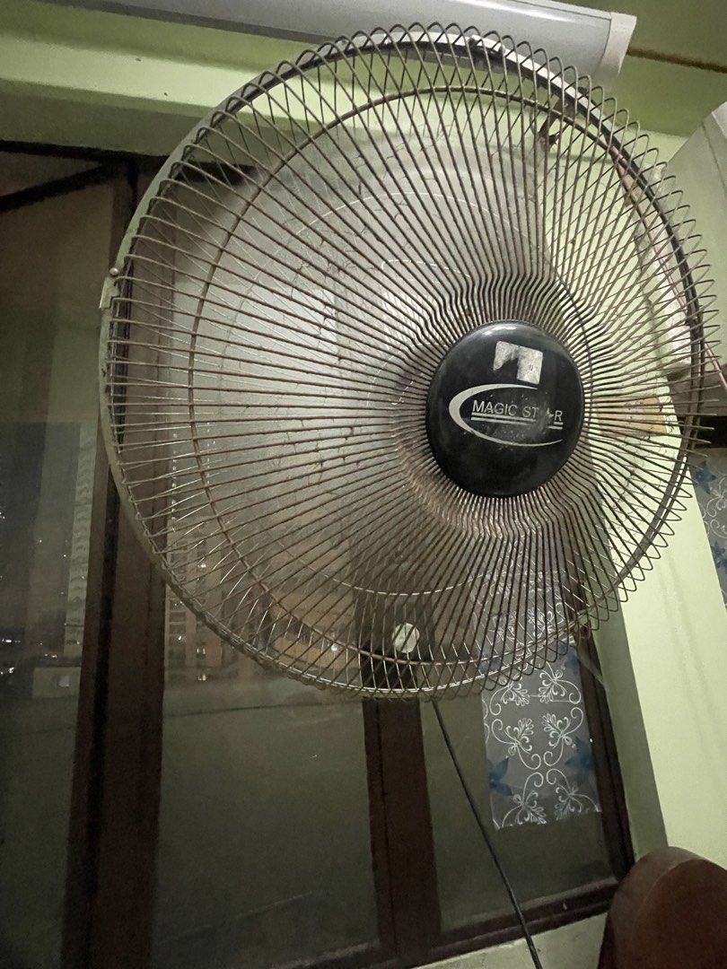 Magic Star Wall Fan (Category: Fans) located in Manila. Submitted by pasaybestfinds (Listing ID 1470054423, Image 1). Description: - Brand/Model: Magic Star Wall Fan - Color: Sleek black grill and center cap - Speed Control: Rotary box with settings 0 to 3 .