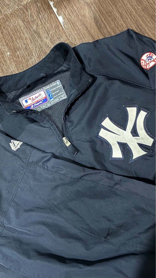 Majestic Athletic New York Yankees Cool Base Pullover Jacket (Category: Coats, Jackets and Outerwear) located in Las Pinas. Submitted by marqusasasas (Listing ID 1470071459, Image 1). Description: - Official MLB Authentic Collection New York Yankees pullover jacket by Majestic - Cool Base technology with moisture-wicking and water-repellent properties - Classic navy blue colorway with embroidered NY chest logo - Team patch on left sleeve and Maje
