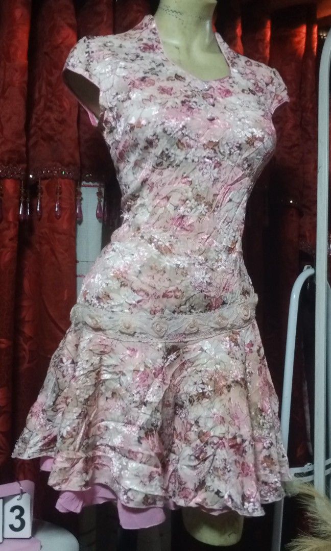 Mandarin style colar dress (Category: Dresses) located in Manila. Submitted by wheneity67thifted (Listing ID 1470136591, Image 2). Description: The image shows a pink floral-patterned Asian-inspired mini dress with a fitted bodice, a Mandarin-style or crossover neckline, cap sleeves, and a tiered flared skirt..
