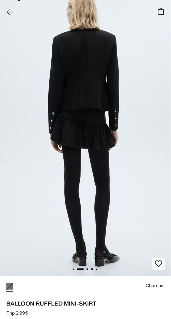 Mango Balloon Black Mini Skirt (Category: Skirts) located in Quezon City. Submitted by dropdeadprices (Listing ID 1470018585, Image 2). Description: - Style: Charcoal wool blend mini skirt with a fun bubble hem and ruffled drop waist - Fit: Mid-rise with belt loops and full interior lining - Closure: Zip, button, and concealed hook-and-loop fastener with placket - Original Retail Price: Php 2,995 - Condition: Great find, perfect for elevating you