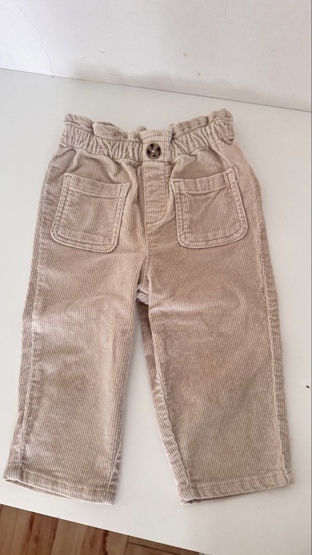 Mango Beige Corduroy Pants 9-12M 80cm (Category: Babies & Kids Fashion) located in General Trias. Submitted by dphazel (Listing ID 1470060816, Image 3). Description: - Brand: Mango - Size: 9-15 months (80 cm) - Color: Classic beige (easy to match with any top) - Material: Soft corduroy with ribbed texture - Features: Elastic waistband for comfort, front button detail, and two front patch pockets - Condition: Worn a few times, very good shape - Pe