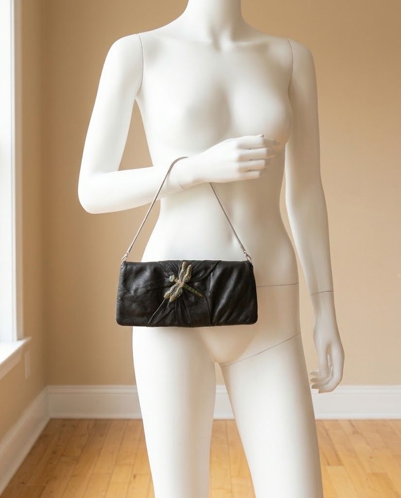 MANGO BLACK CLUTCH BAG (Category: Clutches) located in Marikina City. Submitted by minimalistmanila (Listing ID 1470112319, Image 1). Description: Mango black clutch leather bag with dragonfly metal accent. Bought in Mango Singapore. Size is semi-medium. Ideal for night outs. Order now! .