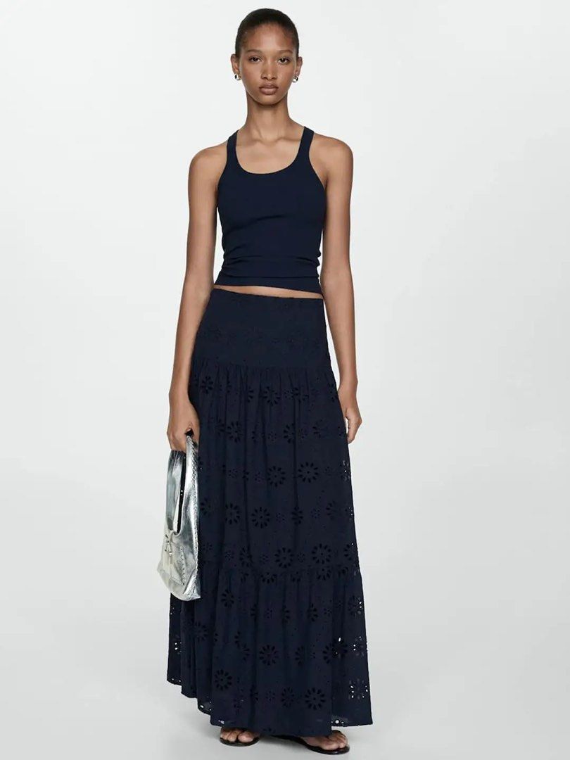 Mango Embroidered Flowy Maxi Skirt Navy Blue (Category: Skirts) located in Quezon City. Submitted by dropdeadprices (Listing ID 1470025526, Image 1). Description: - Style: Flowy tiered maxi skirt - Color: Navy blue - Details: Eyelet floral embroidery throughout - Material: Lightweight and comfortable fabric - Styling: Perfect with basic tanks or crop tops Original retail price: PHP 3,295.