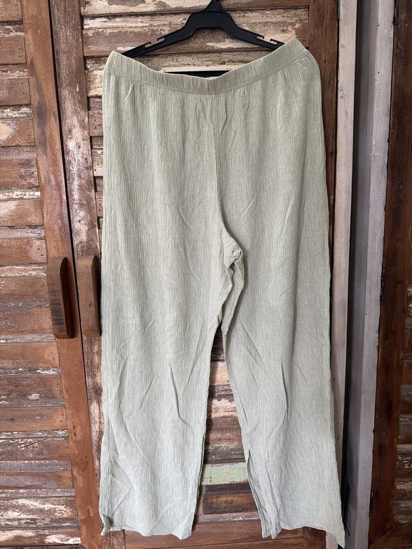Mango Green Textured Wide Leg Pants Size L (Category: Jeans) located in Manila. Submitted by cb_____ (Listing ID 1469970351, Image 1). Description: - Brand: Mango - Color: Light green - Style: Relaxed, breezy wide leg pants - Material: Textured crinkle fabric - Waistband: Elastic for an easy and comfortable fit - Size: EUR-USA L, MEX G, CN XL-170/74A - Condition: Excellent, no flaws found.