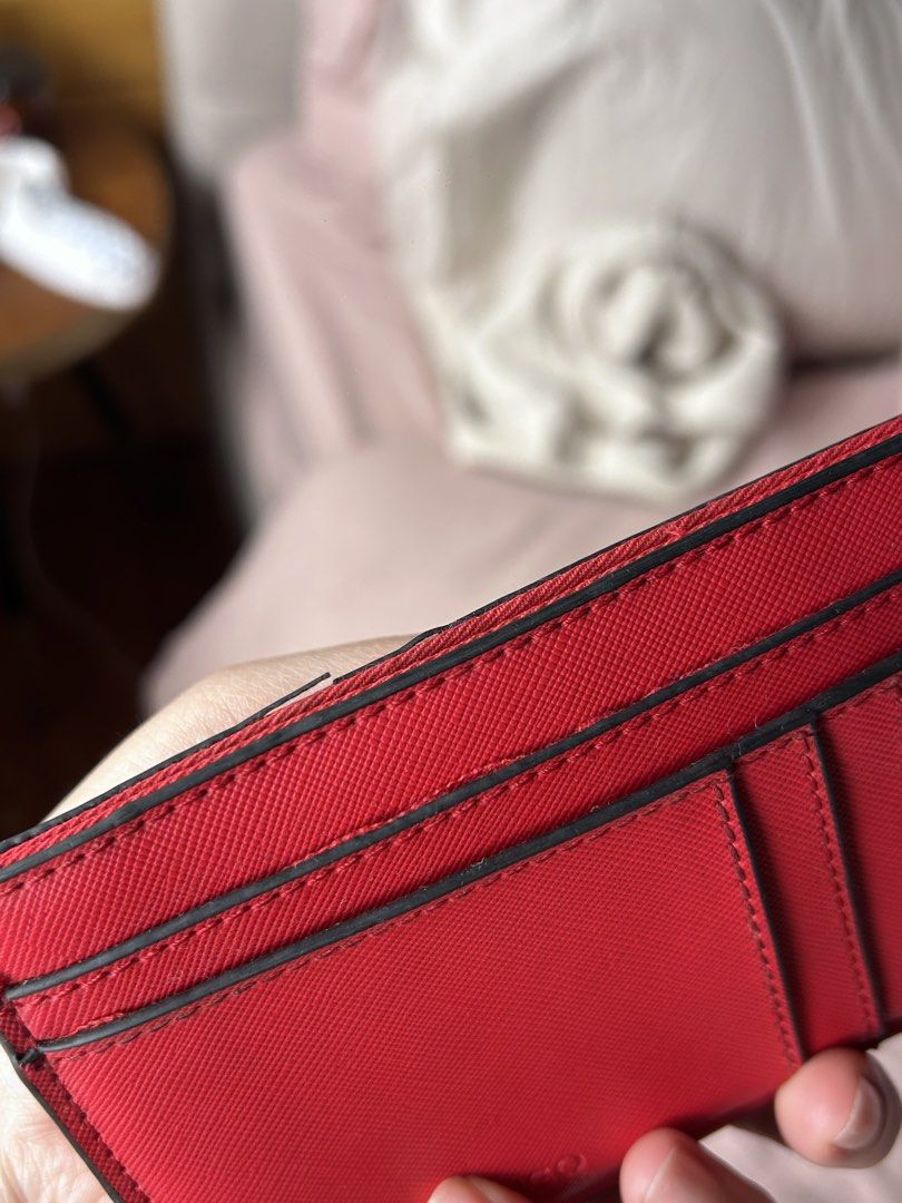 MANGO Red Saffiano Card Holder (Category: Wallets & Card holders) located in Cebu City. Submitted by shopmikascloset (Listing ID 1469955779, Image 3). Description: - Brand: MANGO - Material: Bright red Saffiano leather texture - Storage: Multiple card slots on front and back - Design: Compact size fits easily into pockets or small bags, featuring a crisp debossed logo - Condition: Great everyday accessory with minimal wear along the top edge near