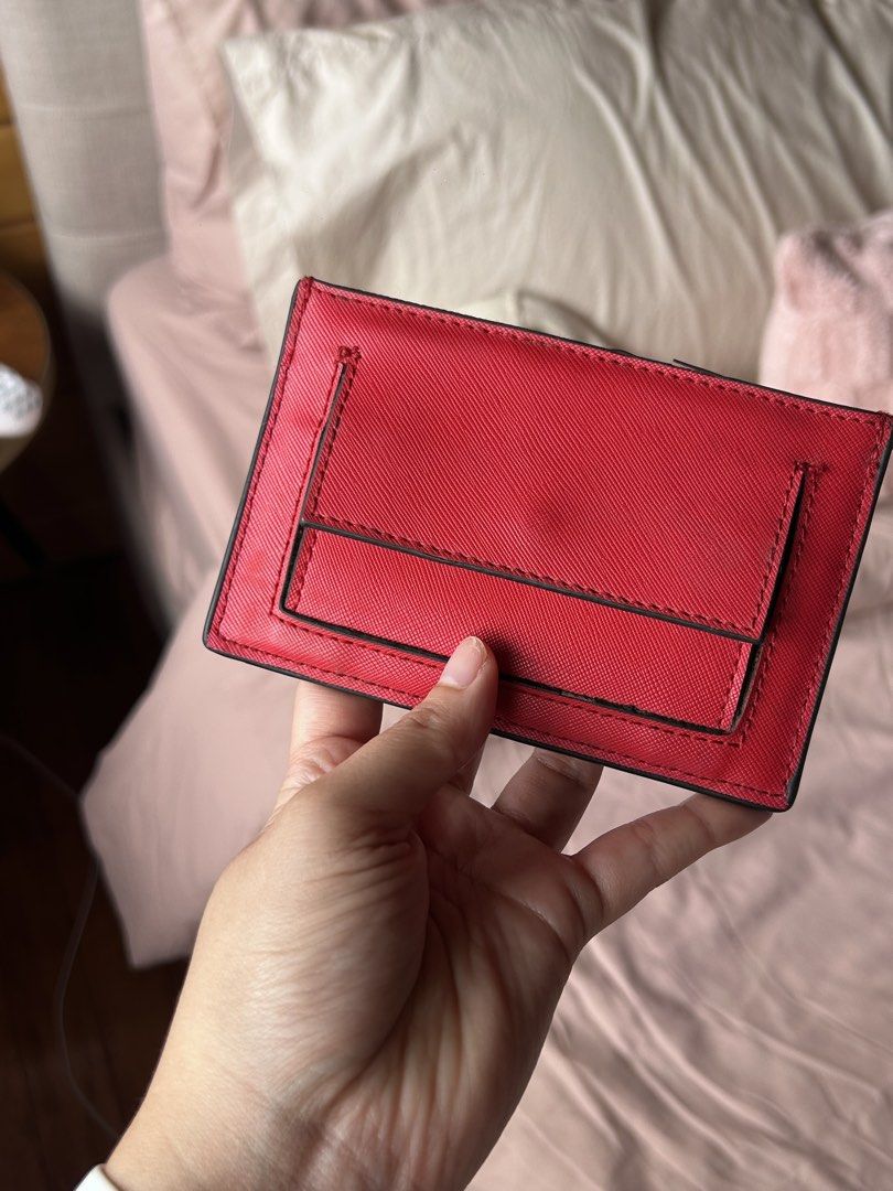MANGO Red Saffiano Card Holder (Category: Wallets & Card holders) located in Cebu City. Submitted by shopmikascloset (Listing ID 1469955779, Image 2). Description: - Brand: MANGO - Material: Bright red Saffiano leather texture - Storage: Multiple card slots on front and back - Design: Compact size fits easily into pockets or small bags, featuring a crisp debossed logo - Condition: Great everyday accessory with minimal wear along the top edge near