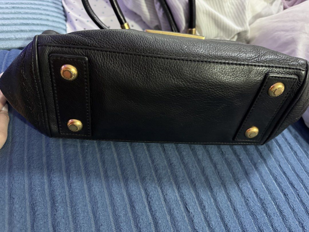 Marc by Marc Jacobs Classic Black Tote Bag (Category: Tote Bags) located in Paranaque City. Submitted by zen_80 (Listing ID 1469978411, Image 2). Description: - Brand: Marc by Marc Jacobs -- Authentic with original dustbag - Material: Premium black pebbled leather - Hardware: Gold-tone with engraved branding - Interior: Black fabric lining with zippered pocket and Made in Indonesia tag - Base: Structured with protective metal feet - Style: Classi