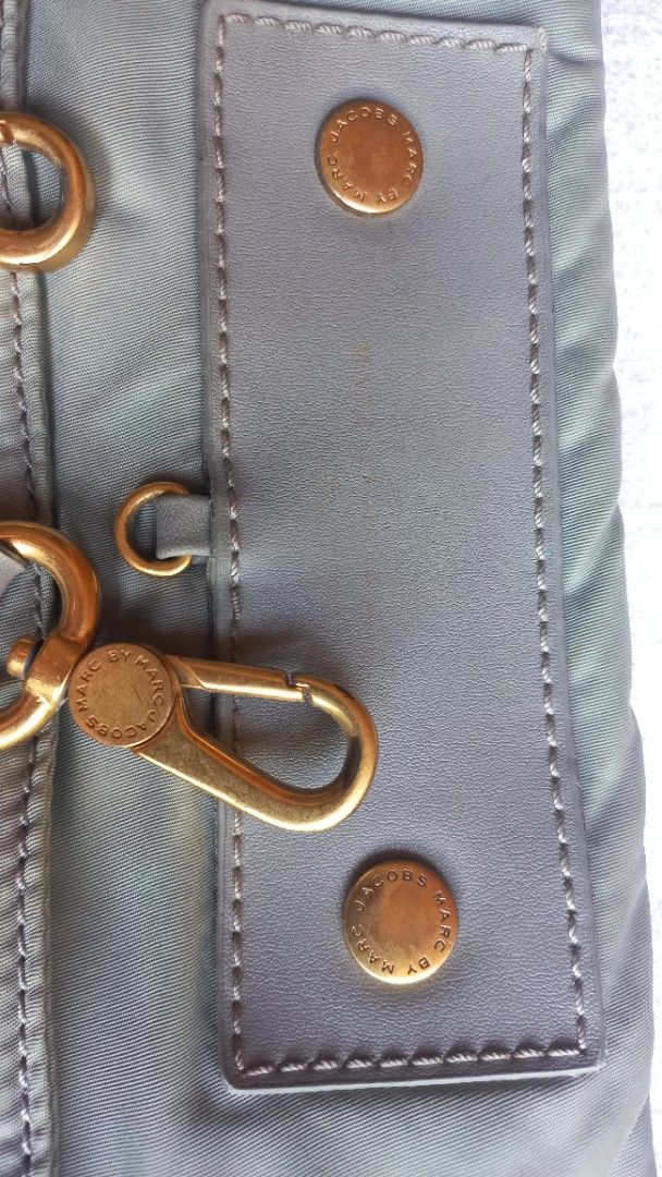 Marc by Marc Jacobs Nylon Shoulder Bag Green (Category: Luxury Bags & Wallets) located in Rizal. Submitted by mayra74 (Listing ID 1470141219, Image 2). Description: Authentic Marc by Marc Jacobs shoulder bag - Color: Green nylon with grey leather trim - Hardware: Gold-tone accents - Pockets: Multiple exterior pockets + interior slip pockets with signature lining - Straps: Dual handles + adjustable, detachable long strap - Size: Great everyday bag