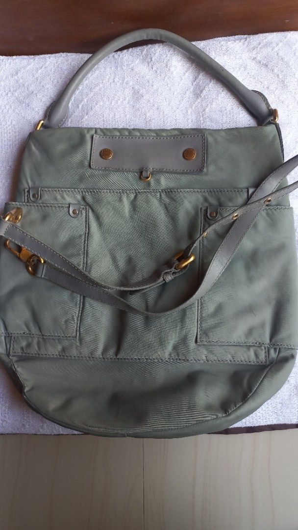 Marc by Marc Jacobs Nylon Shoulder Bag Green (Category: Luxury Bags & Wallets) located in Rizal. Submitted by mayra74 (Listing ID 1470141219, Image 1). Description: Authentic Marc by Marc Jacobs shoulder bag - Color: Green nylon with grey leather trim - Hardware: Gold-tone accents - Pockets: Multiple exterior pockets + interior slip pockets with signature lining - Straps: Dual handles + adjustable, detachable long strap - Size: Great everyday bag