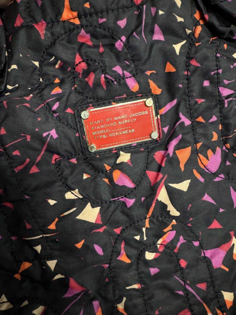 Marc by Marc Jacobs Workwear Quilted Tote Bag (Category: Tote Bags) located in Valenzuela. Submitted by sofiasticated.decluttering (Listing ID 1470085321, Image 3). Description: - Authentic Marc by Marc Jacobs quilted tote bag - Eye-catching black multi-colored geometric/abstract print - Signature red brand plaque on the front - Secure top zip closure with double handles - Spacious interior lined in black and white monogram fabric with a convenie