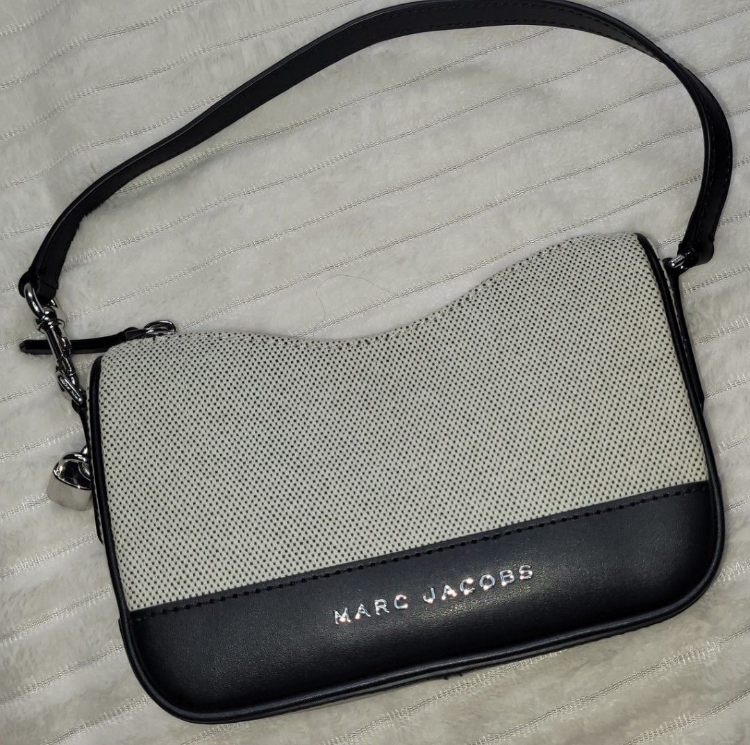 Marc Jacobs Drifter Bag (Category: Shoulder Bags) located in Bocaue. Submitted by thewardrobehub (Listing ID 1470093443, Image 1). Description: - 100% Authentic - convertible to wristlet - Black and white canvas with black leather trim .