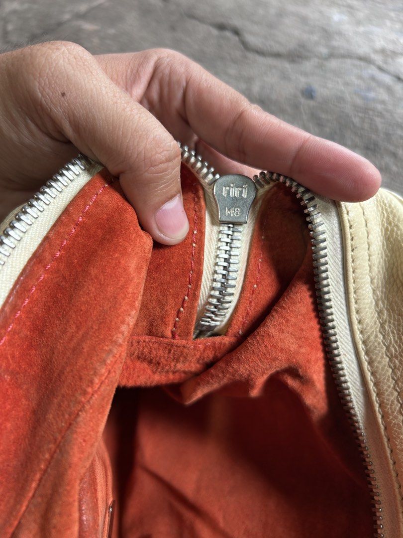 Marc Jacobs Venetia satchel (Category: Luxury Bags & Wallets) located in Dipolog. Submitted by adrian281994 (Listing ID 1469978807, Image 3). Description: - Brand/Model: Authentic Marc Jacobs Designer Handbag - Material: Premium cream leather with vibrant orange suede interior lining - Hardware: Silver-tone hardware with classic early 2000s aesthetic - Exterior Features: Dual top handles, two front flap pockets with secure push-lock closures, and