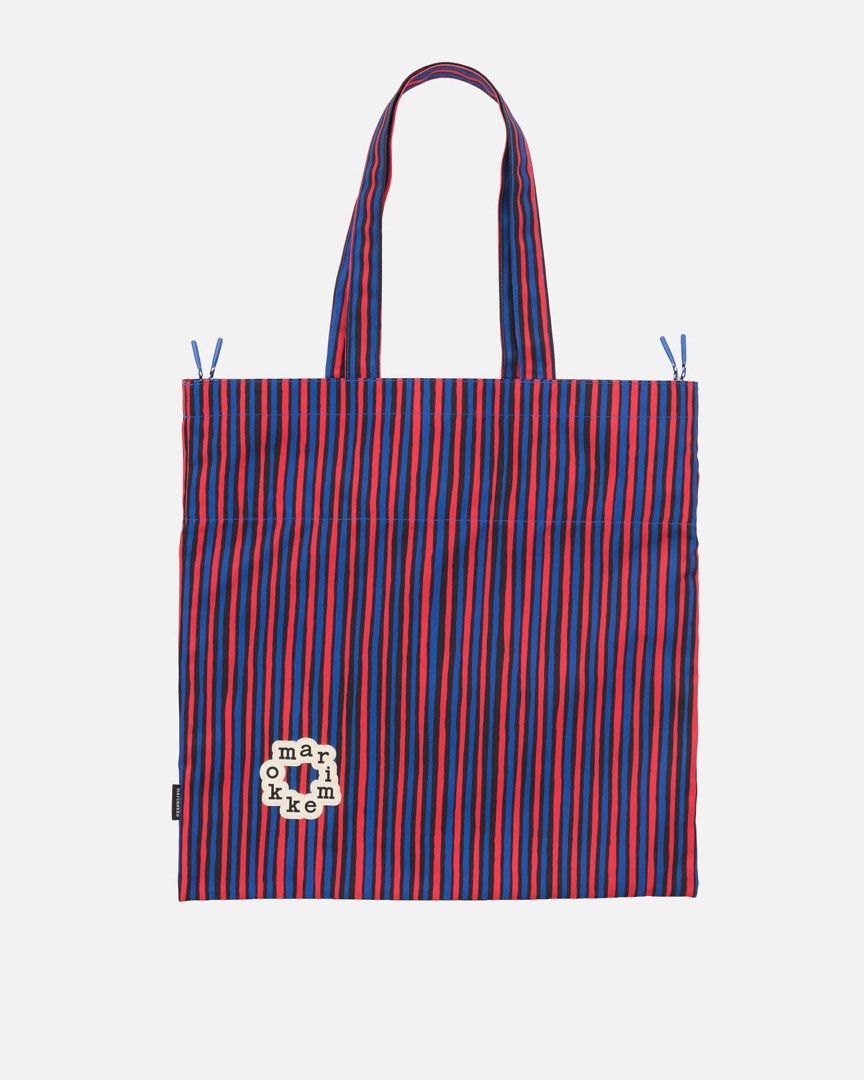 Marimekko Striped Tote Bag Red Blue (Category: Tote Bags) located in Makati City. Submitted by ciriacoria (Listing ID 1470054297, Image 2). Description: - Brand: Marimekko - Design: Red and blue vertical stripes with unique front logo patch - Closure: Drawstring top cinches shut for security - Straps: Comfortable twin shoulder straps - Material: Lightweight fabric construction - Use: Great daily carryall for groceries, books, or essentials - Cond